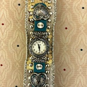 P & G hair on watch. Never worn. Needs batteries. Turquoise and silver.